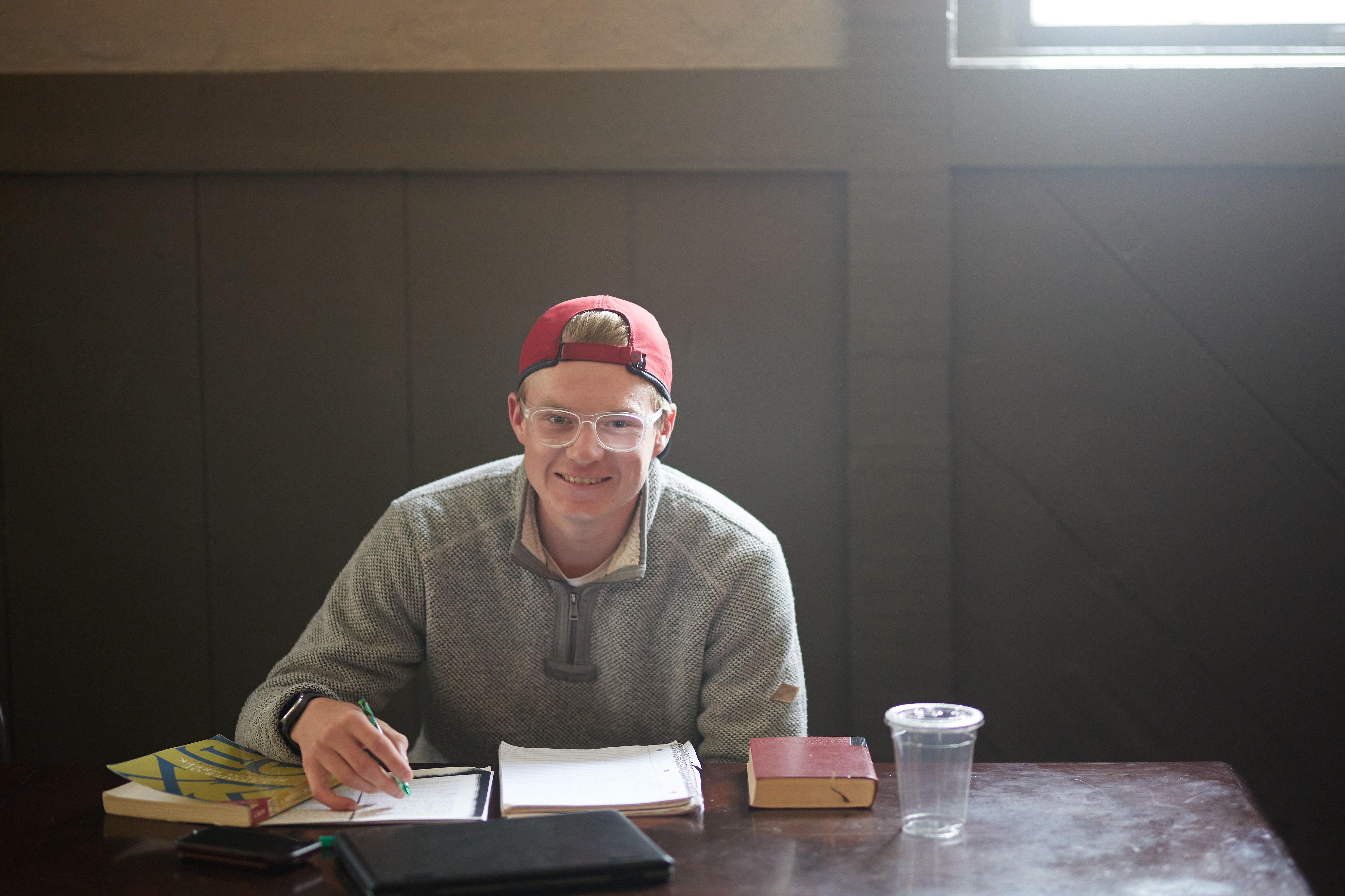 man sitting at desk studying