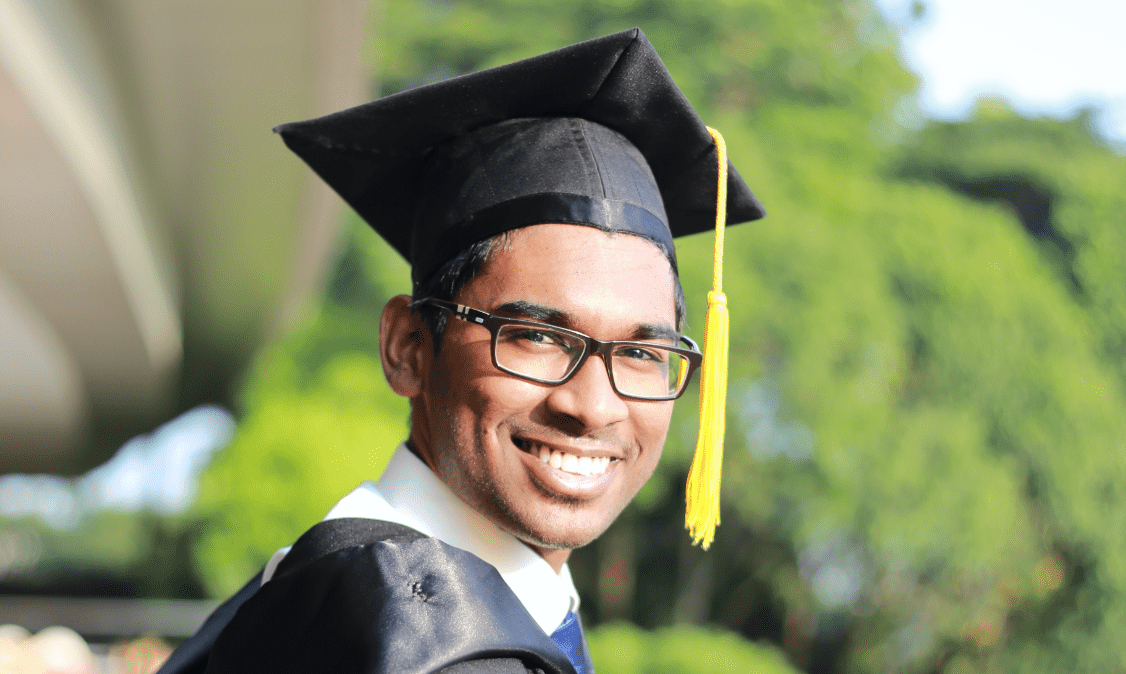 man in graduation cap and gown