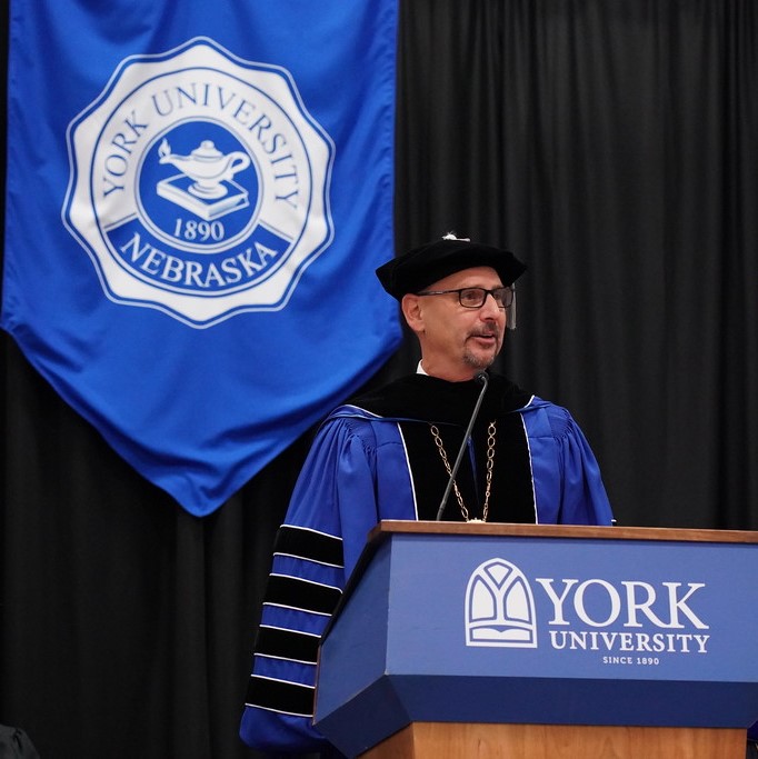 man giving commencement speech